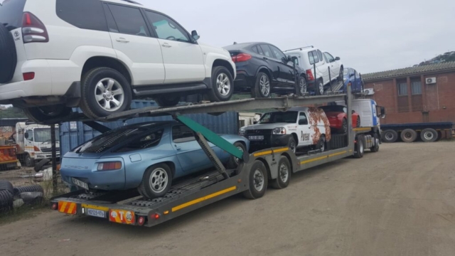 Car Carrier Loaded With A Variety Of Vehicles For Transport