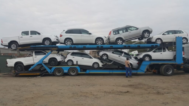 Car Carrier Loaded With A Variety Of Vehicles For Transport