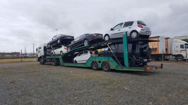 Car Carrier Loaded With A Variety Of Vehicles For Transport
